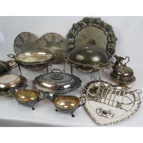 77 - A quantity of mainly antique silver plated serving ware including a salver, covered dishes, sugar ca... 