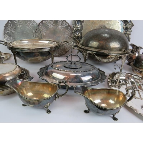 77 - A quantity of mainly antique silver plated serving ware including a salver, covered dishes, sugar ca... 