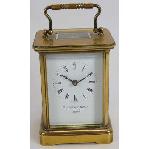 83 - A brass cased 8 day carriage clock by Matthew Norman. Eleven jewel Swiss movement. Height 14.5cm. Ke... 