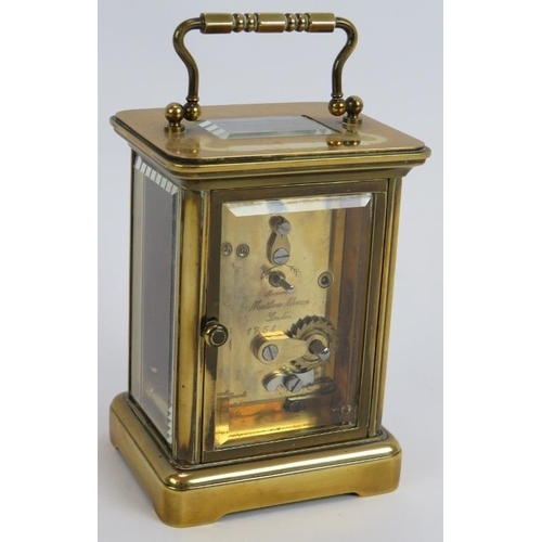 83 - A brass cased 8 day carriage clock by Matthew Norman. Eleven jewel Swiss movement. Height 14.5cm. Ke... 