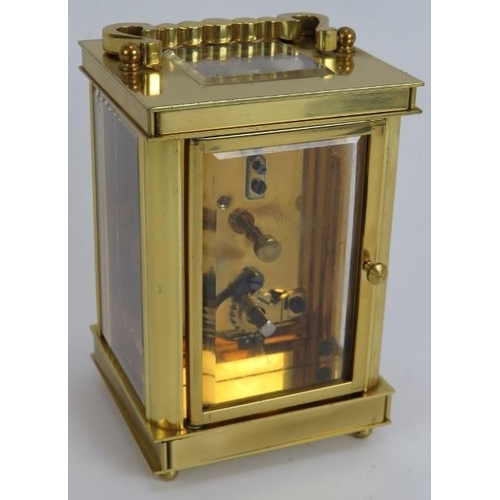 84 - A brass cased 8 day English carriage clock by the London Clock Co. Height 14.5cm. Key present.
Condi... 