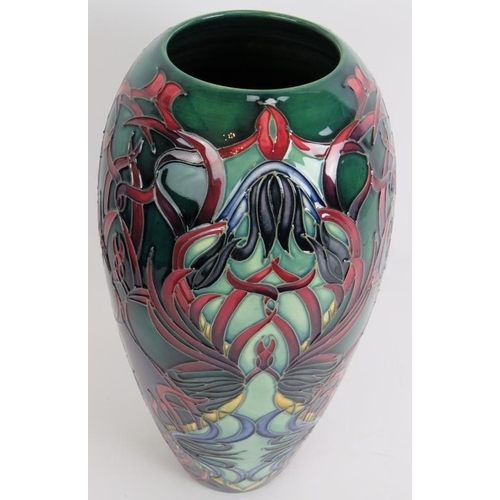 88 - A large limited edition Moorcroft pottery vase of floriate design, signed W Manon 12/150. Height 37c... 