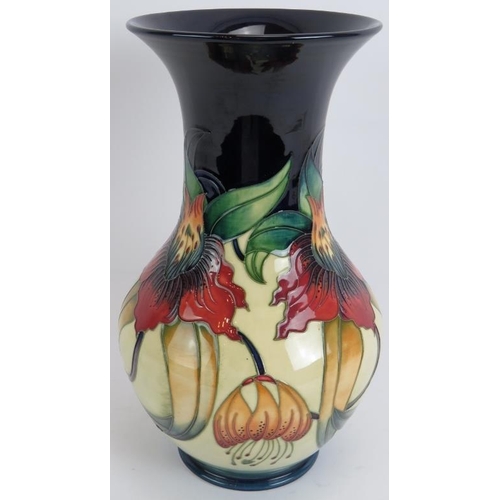 89 - A large Moorcroft pottery baluster vase of Anna Lily design, signed by Nicola Slaney 1998. Height 33... 