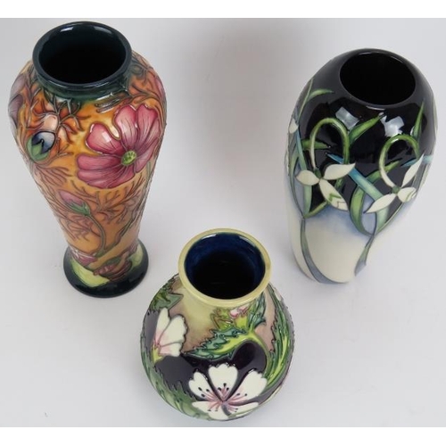 92 - Three contemporary Moorcroft pottery vases, one signed by Philip Gibson. Tallest 21cm. 
Condition re... 