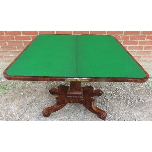 855 - A William IV rosewood turnover card table with inset green baize, featuring gadrooned edging, on a t... 