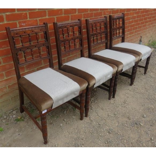 865 - A set of four Edwardian oak dining chairs, with carved and pierced backrests, upholstered in pale gr... 