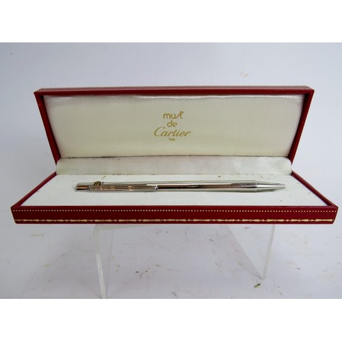 8 - A Must de Cartier trinity ball pen with original case. Serial Number D09369.
Condition report: No re... 