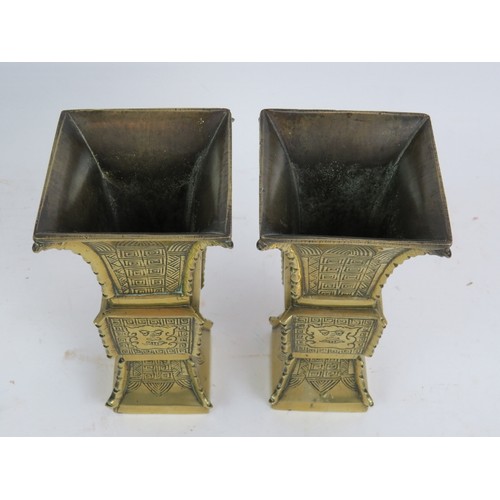 156 - A pair of early 20th century Chinese archaic Revival brass Gu vases of square form. Height 19.5cm. (... 