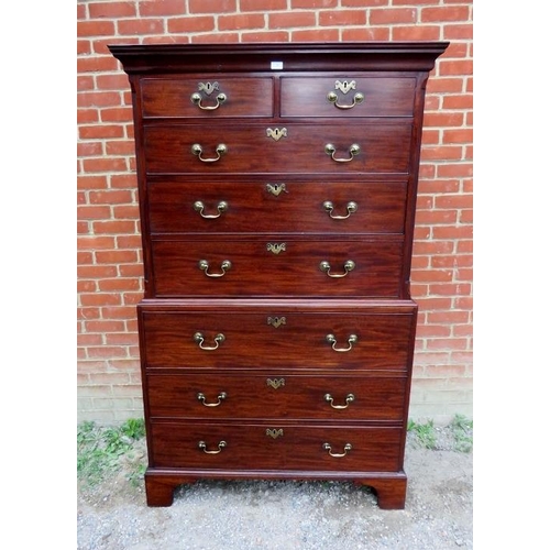 702 - A fine George III mahogany secretaire chest on chest, the top housing two short over three long grad... 