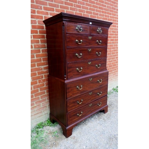 702 - A fine George III mahogany secretaire chest on chest, the top housing two short over three long grad... 