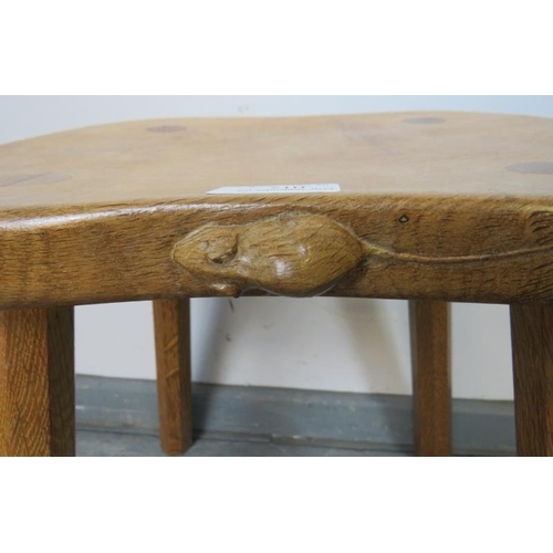 710 - A light oak stool by Mouseman, on canted octagonal supports. 
Condition report: Some varnish loss to... 