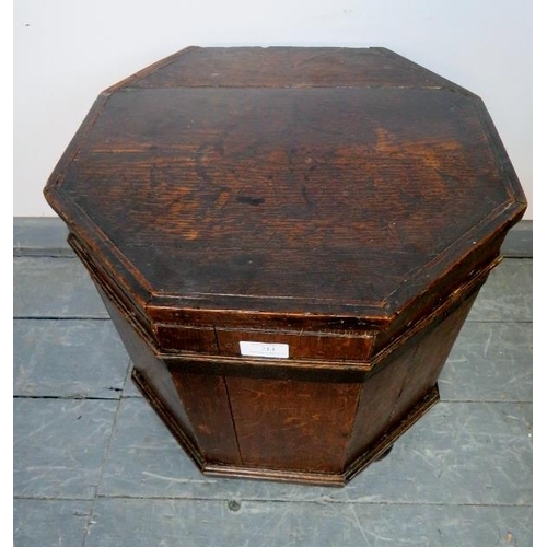 714 - An 18th century oak octagonal cellarette with tin liner and handles to either side, on bun feet. 
Co... 