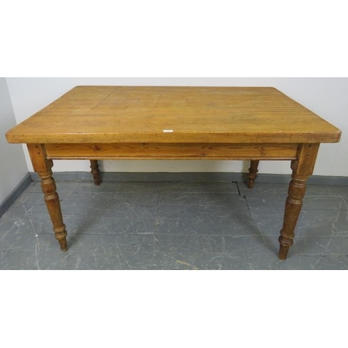 721 - An antique stripped pine scullery table, with long drawer to one end, on turned tapering supports. 
... 