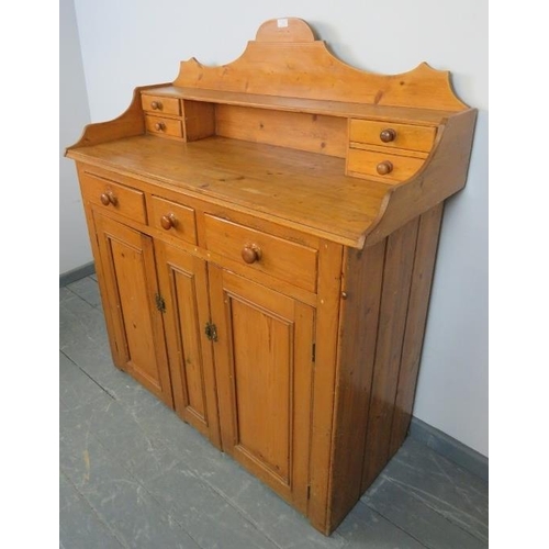 728 - A Victorian pine chiffonier/sideboard, the shaped gallery with four short drawers, the base housing ... 