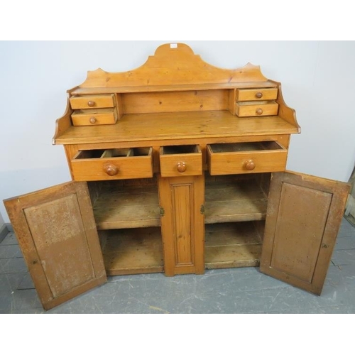 728 - A Victorian pine chiffonier/sideboard, the shaped gallery with four short drawers, the base housing ... 