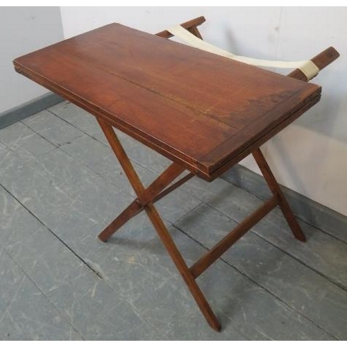 731 - A late 19th century walnut campaign card table, with inset green baize, on a folding ‘X-frame’ base ... 