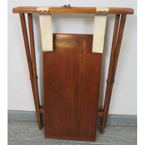 731 - A late 19th century walnut campaign card table, with inset green baize, on a folding ‘X-frame’ base ... 