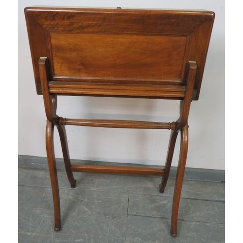 732 - A late 19th century walnut folding campaign writing desk, the interior with inset green gilt tooled ... 