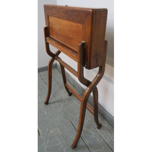 732 - A late 19th century walnut folding campaign writing desk, the interior with inset green gilt tooled ... 