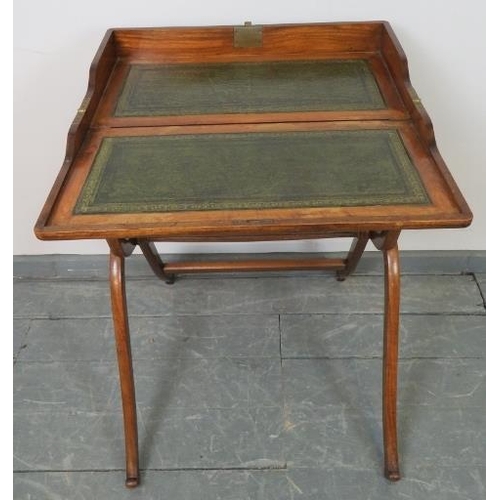 732 - A late 19th century walnut folding campaign writing desk, the interior with inset green gilt tooled ... 