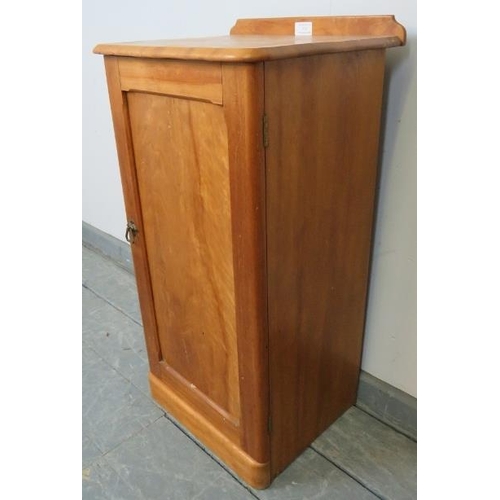 735 - A Victorian satin walnut bedside cabinet, with loose internal shelf, on a plinth base. 
Condition re... 