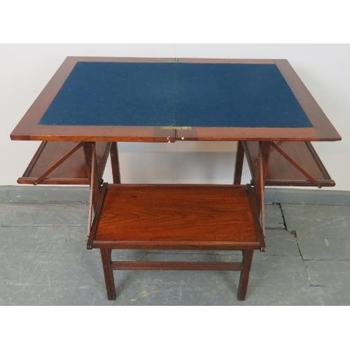 736 - An Edwardian walnut crossbanded campaign inspired turnover card table with inset blue baize and fold... 