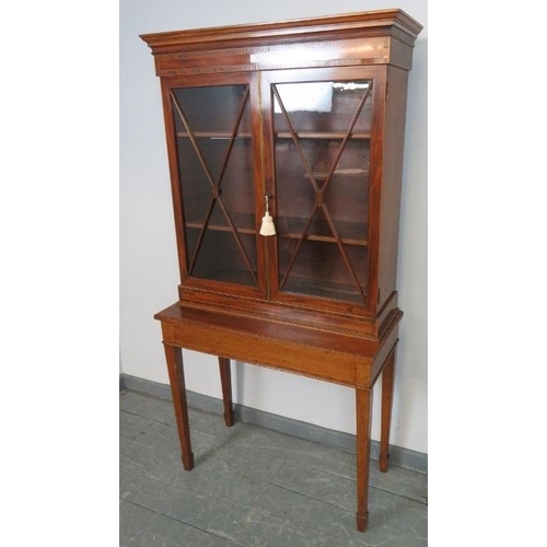 739 - An Edwardian mahogany display cabinet on stand, strung with satinwood and featuring coromandel cross... 