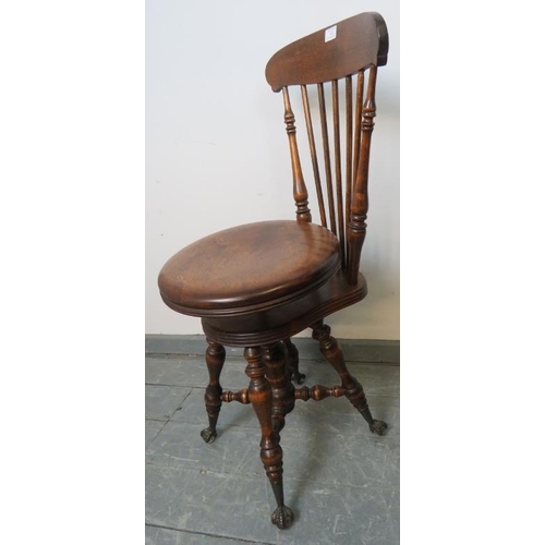 742 - A Victorian walnut cellist’s seat with spindle backrest and height adjustable seat, on turned suppor... 