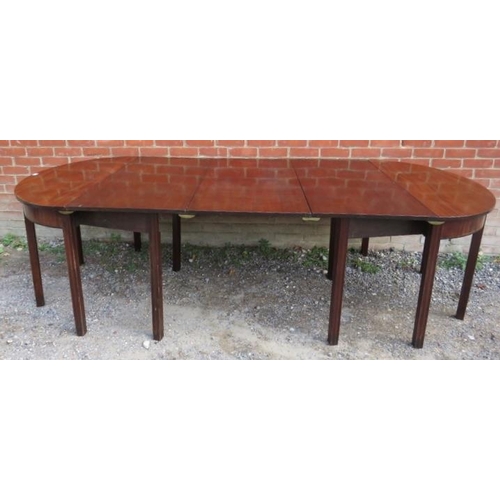 747 - A Georgian mahogany D-end dining table with three additional extending leaves, on inner chamfered sq... 