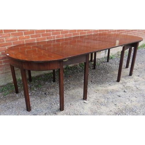 747 - A Georgian mahogany D-end dining table with three additional extending leaves, on inner chamfered sq... 