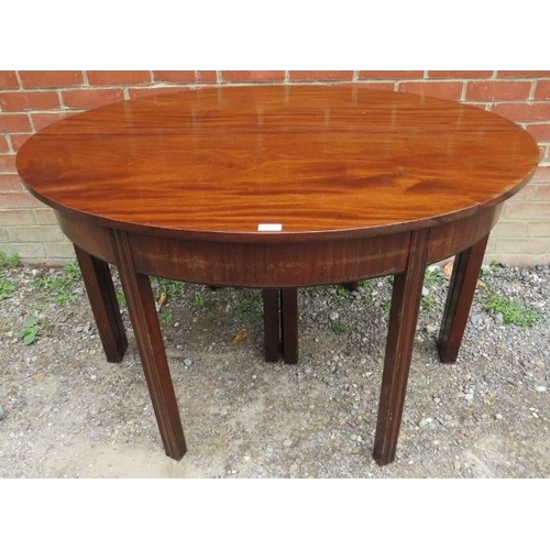 747 - A Georgian mahogany D-end dining table with three additional extending leaves, on inner chamfered sq... 