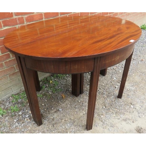 747 - A Georgian mahogany D-end dining table with three additional extending leaves, on inner chamfered sq... 