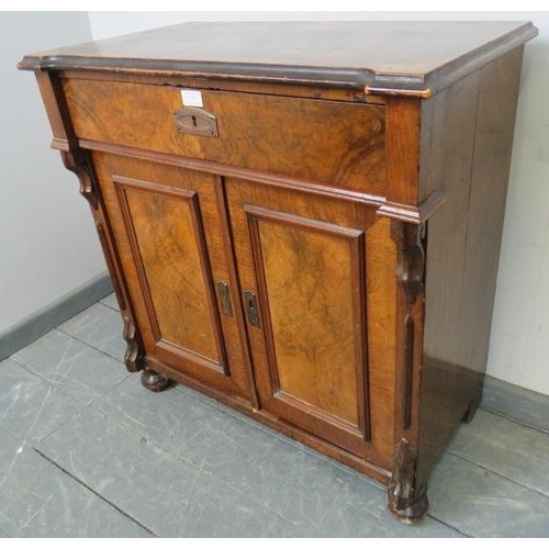 748 - A Victorian burr walnut and mahogany side cabinet, featuring carved corbels, with one long frieze dr... 