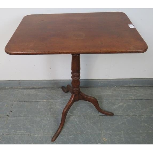 753 - A late Georgian mahogany rectangular tilt-top occasional table, on a baluster turned column with spl... 