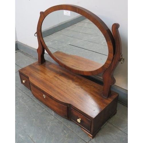 755 - A Georgian oval swing vanity mirror, with shaped uprights, on a breakfront box base with three drawe... 