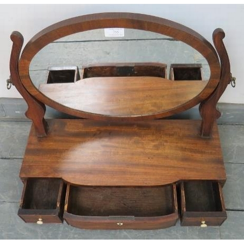 755 - A Georgian oval swing vanity mirror, with shaped uprights, on a breakfront box base with three drawe... 