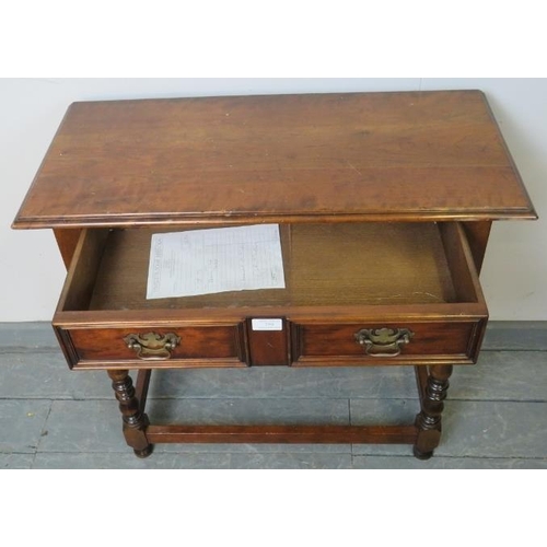 759 - A reproduction cherry wood side table in an 18th century taste, with one long frieze drawer fitted w... 