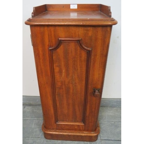 765 - A Victorian walnut bedside cabinet, with ¾ gallery and panelled door, featuring brass campaign style... 