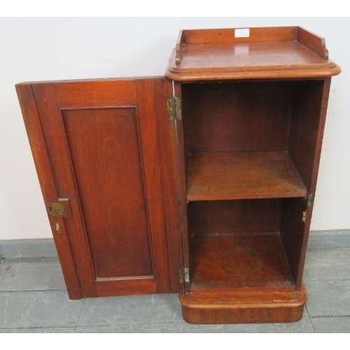 765 - A Victorian walnut bedside cabinet, with ¾ gallery and panelled door, featuring brass campaign style... 