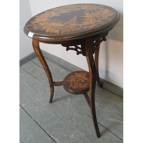 767 - An Arts & Crafts penwork circular two-tier occasional table, on cabriole supports with open fretwork... 