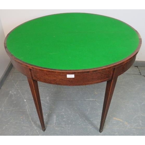 769 - A George III mahogany demi lune card table strung with satinwood, with green baize lined interior, o... 