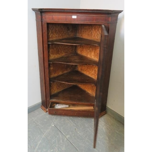 770 - A Georgian oak hanging corner cupboard, with dentil cornice, three fitted shelves and single drawer ... 