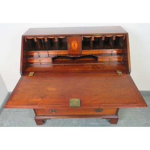 772 - A George III mahogany bureau, with shell inlay and strung with satinwood and ebony, the fall front o... 