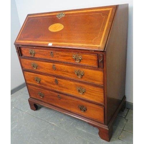 772 - A George III mahogany bureau, with shell inlay and strung with satinwood and ebony, the fall front o... 