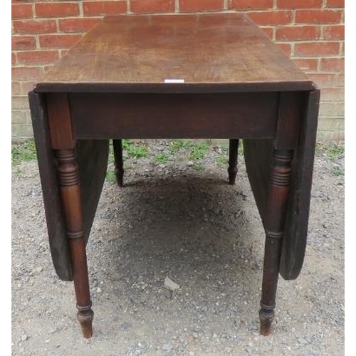 773 - A late Georgian mahogany drop-leaf cottage dining table, on tapering turned supports. 
Condition rep... 