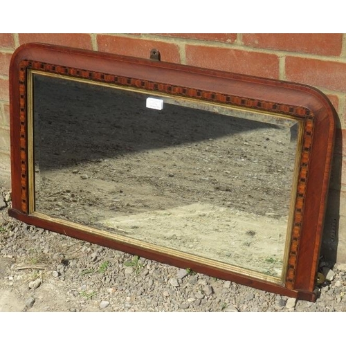 776 - A Regency overmantle mirror in a parcel gilt walnut frame with parquetry inlay. 
Condition report: M... 