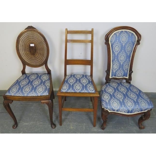 778 - Three walnut occasional chairs, comprising a Victorian nursing chair, Edwardian and Regency Revival ... 