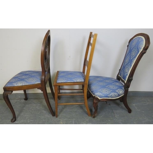 778 - Three walnut occasional chairs, comprising a Victorian nursing chair, Edwardian and Regency Revival ... 