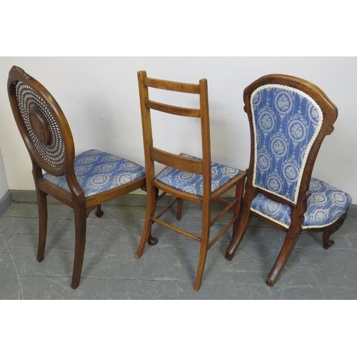 778 - Three walnut occasional chairs, comprising a Victorian nursing chair, Edwardian and Regency Revival ... 