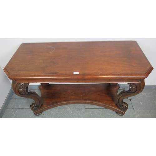 781 - A Victorian mahogany console table, on shell carved and scrolled ogee supports, united by a shaped u... 